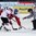 ZUG, SWITZERLAND - APRIL 17: Latvia's Emils Ezitis #21 faces off against the Czech Republic forward during preliminary round action at the 2015 IIHF Ice Hockey U18 World Championship. (Photo by Francois Laplante/HHOF-IIHF Images)
